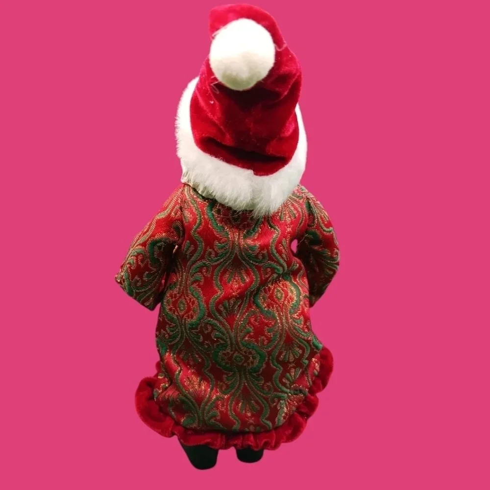 Vintage santa holding gold tree and boot